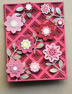 a pink and red card with flowers on it