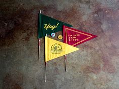 two small flags with the words yogi on them are placed next to each other