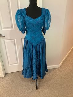 This nice vintage 80s Alfred Angelo Turquoise blue deep v waist huge puff sleeves with bows at bottom and deep v back party dress comes to you in a size S-M. As you can see iconic dress- Blue Puff Sleeve Prom Dresses, Retro Blue Puff Sleeve Dress, Elegant Blue Puff Sleeve Dress With Fitted Bodice, Fitted Puff Sleeve Dress For Prom, Blue Formal Puff Sleeve Dress With Short Sleeves, Blue Puff Sleeve Dress For Party, Blue Puff Sleeve Dress For Evening, Blue Vintage Dress With Fitted Bodice, Elegant Vintage Blue Dress With Fitted Bodice