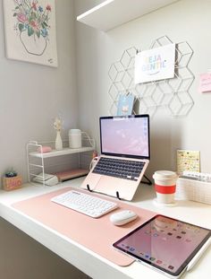 an open laptop computer sitting on top of a desk next to a keyboard and mouse