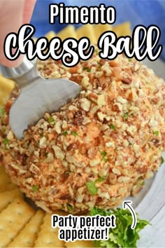 a cheese ball is being held over some crackers