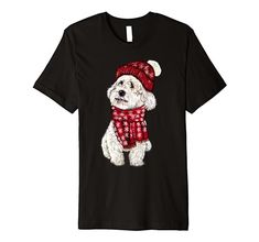 a black shirt with a white dog wearing a red hat and scarf on it's chest