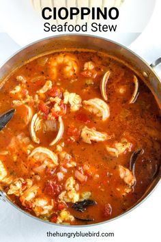 seafood stew with clopino in a pan on a white tablecloth and the title above it