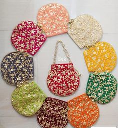 nine purses with different colors and designs on them, all in the same pattern