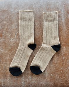 A vintage-esque Cashmere blended socks with a wide ribbing detail and tonal contrasting heel and toe. This elegant and classic sock will be your go to gal during the colder season. Made in South Korea Contents: 24 cashmere 27 superfine wool 27 nylon 20 polyester 2 spandex One size fits most (US women's size 6-10) Cashmere Socks Woman, Fitted Mid-calf Cotton Socks, Classic Mid-calf Cotton Socks, Solid Color Mid-calf Ribbed Socks, Comfortable Brown Mid-calf Socks, Cashmere Socks, Red Rose Petals, Cold Season, Book Sale