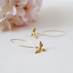 These are lovely bee earrings. Cute little gold bees hang from gold plated long oval hook ear wires. Simple yet adorable, these earrings are great accessories for spring and summer, and would make a wonderful gift for a bee lover :) The bees are made of brass, and measure 13mm.  Total length of these earrings is approx. 2" (54mm). More bee jewelry designs are available in my shop. Some are as seen in the last picture. Thank you for stopping by. Please contact me if you have any questions or need a different quantity :) Custom orders are welcome. ♥ Click the link below to see more beautiful modern earrings: www.etsy.com/shop/LeChaim?section_id=17655958 My shop: http://www.etsy.com/shop/LeChaim About LeChaim: http://www.etsy.com/shop/LeChaim/about an Original and Handmade design of Melanie K Bee Jewellery, Bee Jewelry Gold, Gold Bee Earrings, Gold Bee Necklace, Honey Bee Earrings, Bee Jewelry, Gold Bee, Bee Earrings, Long Dangle Earrings