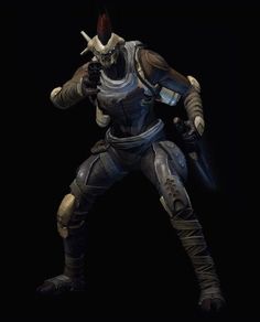 an action figure is posed in the dark with his arms out and two hands on his hips