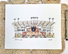 a drawing of the inside of a stadium with ropes around it and a pen next to it