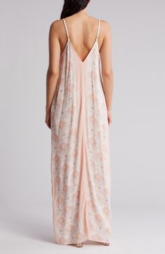 For slimming style and a flattering fit, this maxi slipdress is an easy winner in the wardrobe game. 59" length (size Small/Medium) Slips on over head V-neck Adjustable straps 50% rayon, 50% viscose Dry clean Imported Feminine Daywear Maxi Dress In Viscose, Flowy Unlined Maxi Dress For Daywear, Flowy Daywear Maxi Dress, Daywear Sundress Maxi Dress Unlined, Daywear Longline Maxi Dress, Unlined Maxi Dress For Daywear, Flowy Maxi Dress With Spaghetti Straps For Daywear, Maxi Dress With Side Slits For Loungewear, Feminine Beach Maxi Dress With Spaghetti Straps