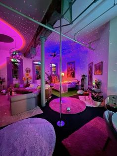 the room is decorated in purple and pink colors with round rugs on the floor