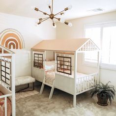 a bedroom with bunk beds and a house shaped bed