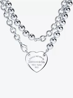 Tiffany & Co.’s Return to Tiffany collection is inspired by the jeweller's iconic key ring first introduced in '69. Now, for the extra-large Heart Tag wrap necklace, it’s reinvented, but once again with that telltale heart brand engraved on its 925 sterling-silver pendant. Rather than trek all the way to New York City and take in the city sights, we suggest you save those precious air miles then present yours to someone you love (and never look back). Silver Heart Choker Necklace With Chain, Luxury Silver Heart Necklace With Heart Charm, Luxury Heart-shaped Sterling Silver Necklace, Luxury Heart Shaped Sterling Silver Necklace, Elegant Heart-shaped Sterling Silver Chain Necklace, Elegant Heart Necklace With Silver Chain, Elegant Sterling Silver Heart Chain Necklace, Elegant Silver Heart Chain Necklace, Silver Double Heart Jewelry With Chain