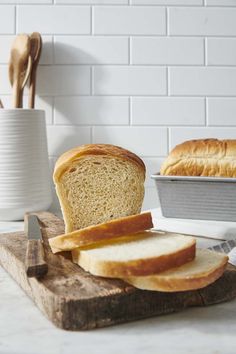 a loaf of bread sitting on top of a cutting board