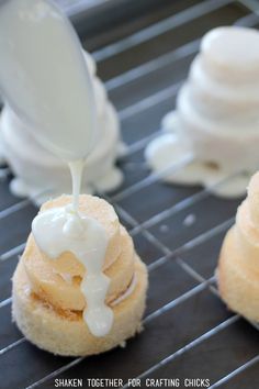 some kind of dessert that is being drizzled with icing