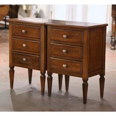 two wooden drawers sitting on top of each other