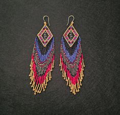 Handmade vibrant southwestern gold/red/blue fringe earing's. 125.00 Fringe Earrings, Red Gold, Red Blue, Jewelry Earrings Dangle, Red And Blue, Dangle Drop Earrings, Dangle Earrings, Jewelry Earrings, Bathing Beauties