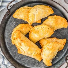 some pastries are sitting in a pan on a table