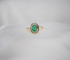 Oval Emerald Gemstone Gold Ring RING DETAILS * Material: 8K, 14K, 18K Solid Gold * Gold Color : Yellow Gold,White Gold,Rose Gold * Gemstone : 7x5 mm Oval Cut Natural Emerald * Ready to Ship in 1-5 Business Days When you are buying jewelry as a gift, you are welcome to leave a short MESSAGE for the gift recipient. We will enrich the package with a NOTE. If you have any questions, feel free to contact us! For more please visit our page -> https://etsy.me/3txcbJb For custom order -> https://etsy.me/3WnEmHd Classic Oval Bezel Set Opal Ring, Gold Oval Birthstone Ring With Polished Finish, Oval Yellow Gold Emerald Ring With Birthstone, Oval Opal Ring With Polished Finish In Fine Jewelry, Classic Oval Opal Ring With Bezel Setting, Oval Cabochon Birthstone Promise Ring, Oval Yellow Gold Emerald Ring As Birthstone, Yellow Gold Rings With Oval Cabochon Gemstone, Oval Opal Ring For May Birthstone