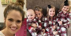 a woman and her four children wearing matching flannel pajama's