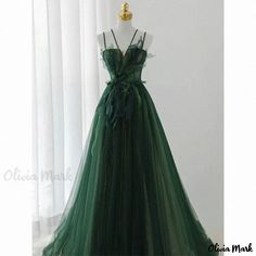 Olivia Mark - Green Formal Evening Gown with Spaghetti Straps - Perfect for Weddings, Galas, and Special Events Green Ball Gown With Sweetheart Neckline And Sweep Train, Green Ball Gown With Sweep Train And Sweetheart Neckline, Green Tulle Formal Ball Gown, Green Ball Gown Wedding Dress With Sweep Train, Green Floor-length Ball Gown For Bridesmaids, Green Floor-length Bridesmaid Ball Gown, Green Sweetheart Neckline Evening Dress For Wedding, Green Wedding Dress With Sweep Train For Debutante Ball, Wedding Gown With Spaghetti Straps And Sweep Train