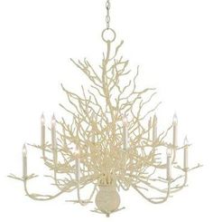 a white chandelier with candles hanging from it's center branch and branches in the middle