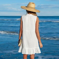 The Ruffle Hem Mini Cover-Up Dress is a breezy essential for beach days and poolside lounging. Its ruffle hem adds a playful touch to the classic white design, providing lightweight coverage. Whether you're soaking up the sun or enjoying a leisurely stroll, this cover-up dress is the perfect companion for a day of relaxation and enjoyment. Product code: CAA05A4C003CC, CAA05A4C003AA, CAA05A4C003UU Beach Days, Cover Up Dress, White Design, Classic White, Ruffle Hem, Summer Wardrobe, Beach Day, Relaxation, Cover Up