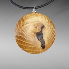 Beautiful, elegant handmade wooden pendant, round (Ø 40 mm/1.57 inch) with an oval surface on both sides, made from genuine robinia wood on a round rubber band (Ø 2 mm/0.08 inch) with a lobster clasp made from 925 silver. ⸙ The wooden pendant is oval on both sides. The surfaces are finely sanded and the outer edges are subtly rounded. The oval back/front and the warmth of the wood make the necklace very comfortable to wear on the skin of your décolleté. ⸙ MATERIALS: »» Wood type: Robinia wood (R Natural Color Nature-inspired Round Jewelry, Nature-inspired Round Natural Jewelry, Round Wood Jewelry As A Gift, Round Wooden Jewelry For Gifts, Round Wooden Jewelry Gift, Handmade Round Wooden Jewelry, Natural Wood Pendant Jewelry As Gift, Handmade Wooden Pendant Jewelry, Natural Wood Pendant Jewelry For Gifts