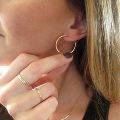 "These delicate hand crafted 14k gold filled, sterling silver, or rose gold filled hoops are hand shaped, filed, forged and polished to a glittering finish. The high quality metal will never turn no matter how much you wear them - just clean them with some windex or warm soapy water and they're good to go! They measure 1\" in diameter, are virtually weightless, and close with a loop in the back. These earrings are in it for the long haul : we only use high quality 14k gold filled and rose gold f Hypoallergenic Small Hoop Earrings In 14k Gold Filled, Nickel-free 14k Gold Hoop Jewelry, Everyday 14k Rose Gold Filled Jewelry, Simple Hypoallergenic Huggie Jewelry, Minimalist Hoop Jewelry As Gift, Everyday Rose Gold Sterling Silver Huggie Earrings, Minimalist Hoop Jewelry Gift, Everyday Hammered Rose Gold Jewelry, Simple Hypoallergenic 14k Gold Jewelry