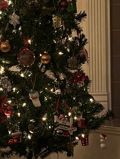 a christmas tree is decorated with ornaments and lights