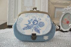 a blue and white purse sitting on top of a table