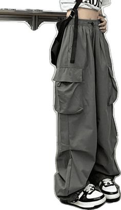 Combat Style Wide Leg Parachute Pants With Side Pockets, Winter Baggy Cargo Jeans, Baggy Cargo Jeans With Side Pockets For Winter, Baggy Combat Bottoms With Pockets, Combat Style Baggy Bottoms With Multiple Pockets, Combat Wide Leg Cargo Pants With Pockets, Baggy Combat Bottoms With Multiple Pockets, Baggy Parachute Pants With Pockets For Fall, High Waist Parachute Pants With Patch Pockets For Streetwear