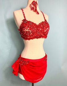 a woman's red skirt and top on display