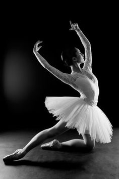 a black and white photo of a ballerina