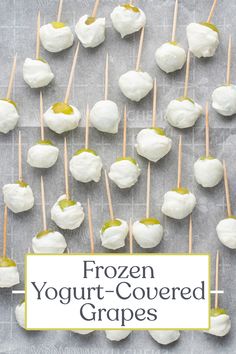 frozen yogurt - covered grapes on a baking sheet with text overlay that reads frozen yogurt - covered grapes