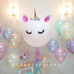 a unicorn themed birthday party with balloons and streamers