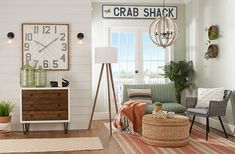 a living room filled with furniture and a clock on the wall