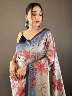 The cream and blue silk saree adorned with exquisite Kalamkari print work and delicately attached tassels on the pallu. With 5.50 meters of sheer elegance, this saree is poised to elevate your wardrobe, infusing it with the breezy vibrancy of the season and ensuring you stand out at every upcoming festival, occasion, or special function.
The combination of cream and blue hues creates a mesmerizing contrast that exudes both tranquility and vibrancy, while the intricate Kalamkari print work adds a Elegant Multicolor Saree With Kalamkari Print, Unstitched Elegant Kalamkari Blouse Piece, Elegant Multicolor Kalamkari Print Saree, Elegant Multicolor Kalamkari Saree, Elegant Art Silk Saree With Kalamkari Print, Elegant Kalamkari Print Saree For Diwali, Elegant Wedding Saree With Kalamkari Print, Elegant Tussar Silk Saree With Kalamkari Print, Elegant Silk Saree With Kalamkari Print