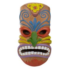 a wooden mask with flowers on it's head and eyes painted red, blue, yellow and green