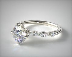 a diamond engagement ring on a white background