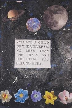 an art piece with flowers, planets and a sign that says you are a child of the universe no less than the trees and the stars you belong