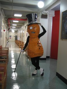 a person in a costume walking down a hallway