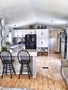 the kitchen is clean and ready to be used as a living room or dining area