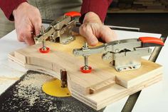 a man working on a piece of wood with two vices attached to the board