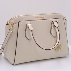 Michael Kors Daria Large Satchel Bag Leather Light Cream Leather Polished Gold-Tone Hardware Two Open Compartments With Magnetic Snap Button Closure Divided By Zip Compartment In The Middle Two Open Compartments Divided By Zip Compartment In The Middle Interior One Zippered And One Open Slip Pocket Logo Lined Interior Logo Details Measurements: 12.5"Bottom (L) X 9.5"Center (H) X 6" (W) Michael Kors Handbags Black, Micheal Kors Handbag, Michael Kors Selma Medium, Black Satchel, Mk Bags, Light Cream, Black Purses, Satchel Handbags, Purses Michael Kors