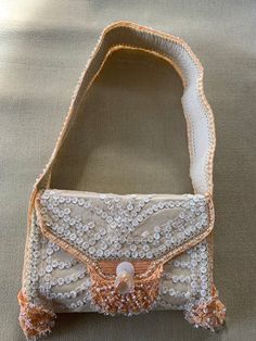 "Buba, beaded leather shoulder bag, in beautiful as close to new as you can get, peach, beige, mother of pearl shaded beads, is a stunning statement of bold \"Pretty Woman\" style." Bohemian Cream Beaded Bag, Beige Embellished Rectangular Shoulder Bag, Traditional Embellished Beige Shoulder Bag, Summer Beige Embellished Shoulder Bag, Evening Cream Embroidered Shoulder Bag, Cream Embroidered Shoulder Bag For Evening, Evening Embroidered Cream Shoulder Bag, Beige Beaded Festival Bags, Bohemian Crossbody Shoulder Bag For Party