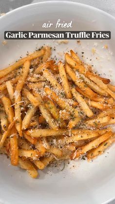 garlic parmesan truffle fries on a white plate with text overlay reading air fried garlic parmesan truffle fries