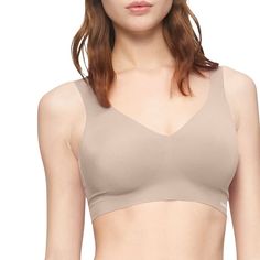 Smooth, soft, seamless lift and comfort makes all-day wear easy with this microfiber stretch plunge bralette by Calvin Klein.Click on this INTIMATES & SLEEPWEAR Guide to find the perfect fit and more! Pullover styling Plunging V-neck design Bonded panels for additional support and lift Full coverage Removable pads Seamless elastic band Logo at front left hemFABRIC & CARE Nylon, elastane Machine wash Imported Size: X Small. Color: Black. Gender: female. Age Group: adult. Pattern: Solid. Band Logo, Clean Cut, Neck Designs, Pullover Styling, Push Up, Bralette, Calvin Klein, Sports Bra, Perfect Fit