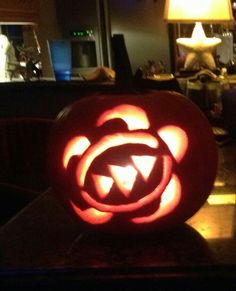 a carved pumpkin sitting on top of a table