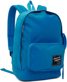 Nylon satin backpack in blue. · Webbing carry handle · Padded adjustable shoulder straps · Zip pocket and logo patch at face · Carry handle at side · Two-way zip closure · Patch pocket at interior �· Laptop compartment · Satin lining · H15 x W10 x D6.25 Supplier color: Enamel blue Travel Backpack, Patch Logo, Patch Pocket, Zip Pockets, Laptop, Backpacks, Satin, Outfit Accessories, ? Logo