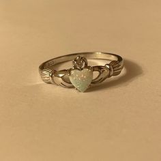 Stamped 925 Sterling Silver Heart Shape Synthetic Opal And Cubic Zirconia New, Never Worn Ring Size 10 White Sterling Silver Heart Promise Ring, White Sterling Silver Promise Heart Ring, White Heart Cut Ring With Birthstone, White Heart-shaped Birthstone Ring, White Sterling Silver Heart Ring, White Sterling Silver Heart Ring With Birthstone, White Sterling Silver Heart Ring Fine Jewelry, White Sterling Silver Heart Ring As Gift, Silver Heart Ring